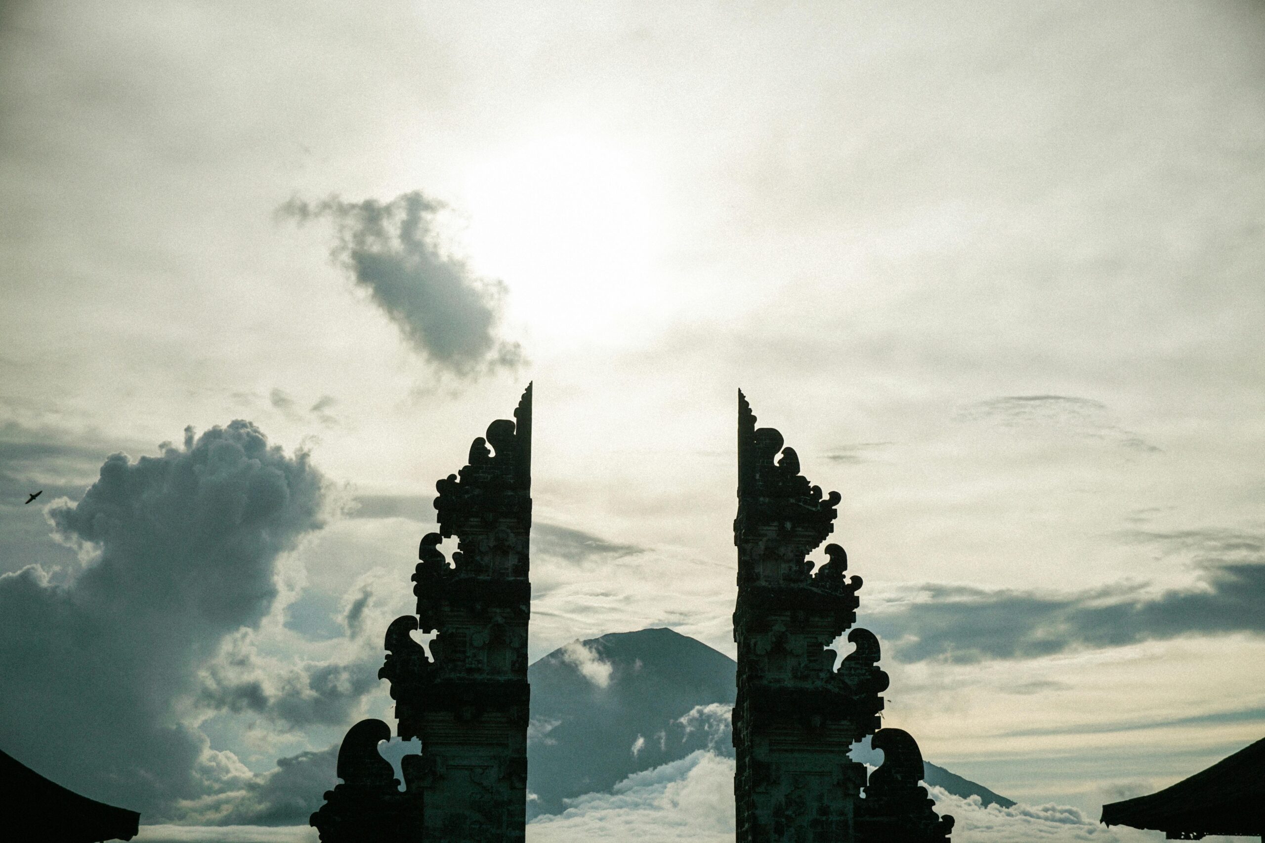 Silhouette of Pura Lempuyang's iconic gates with dramatic sky in Bali, Indonesia.