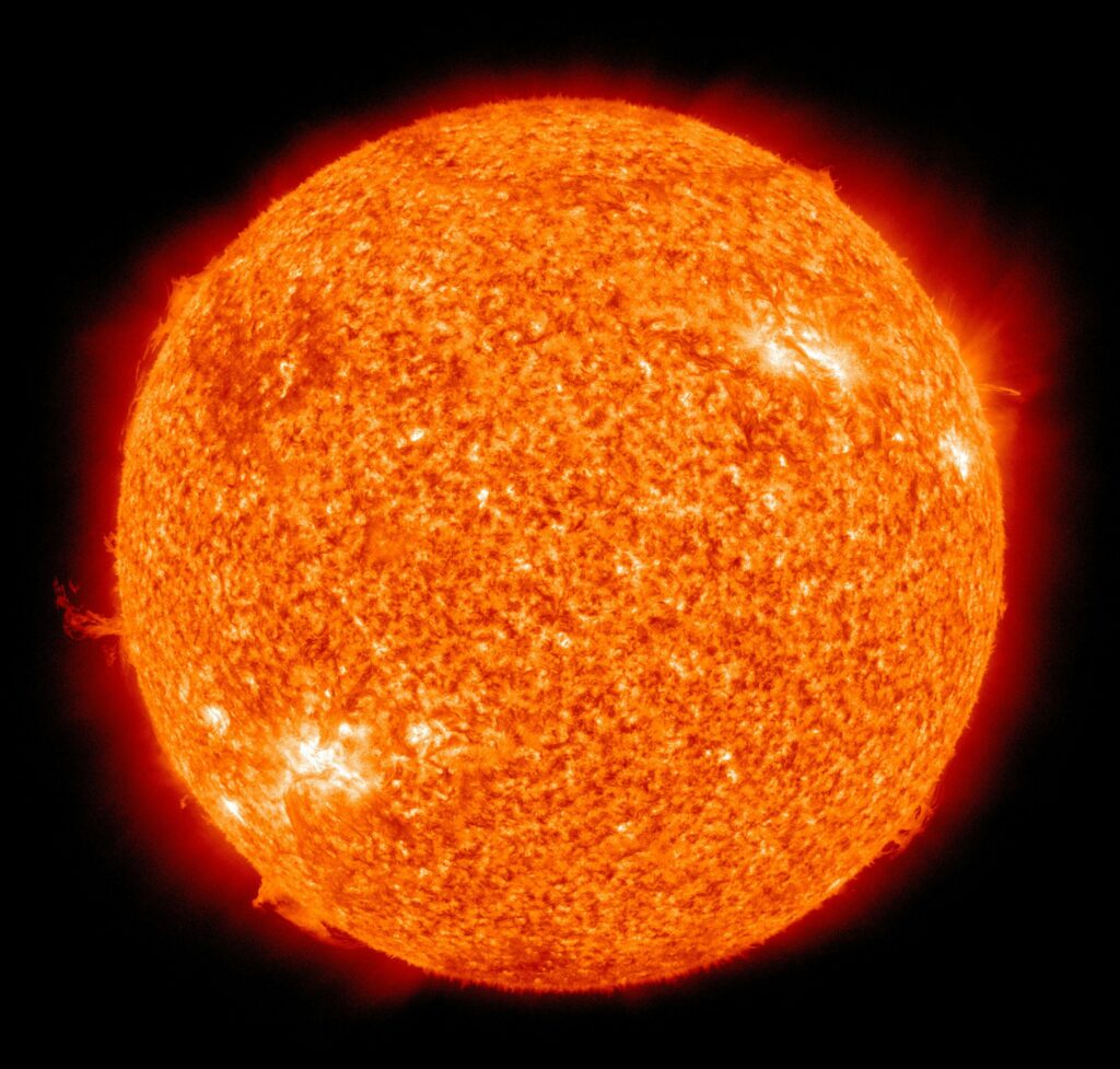 Detailed image of the sun showcasing its fiery surface and glowing edges.